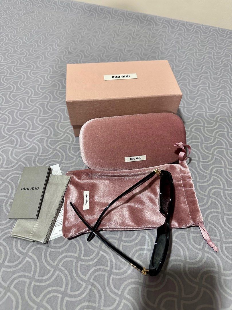 Miu Miu Oval Sunglasses