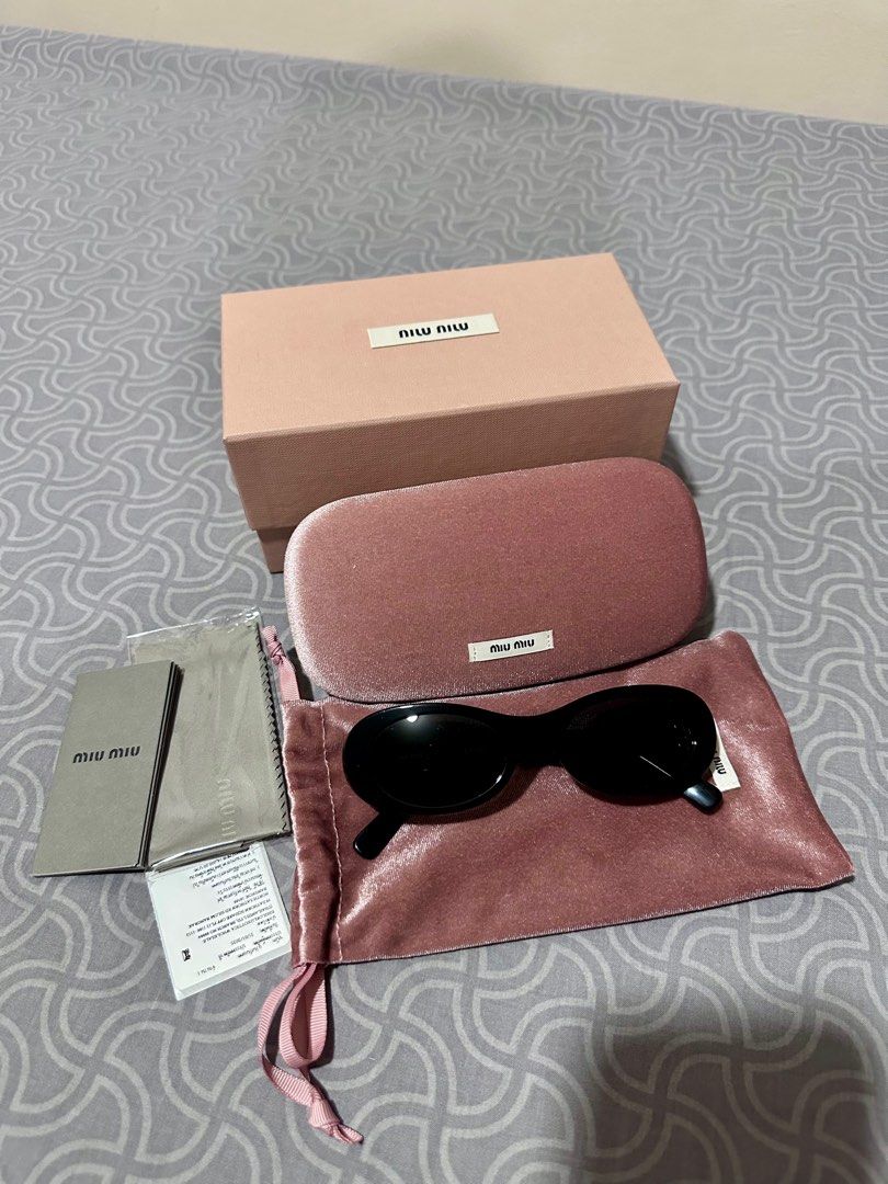 Miu Miu Oval Sunglasses