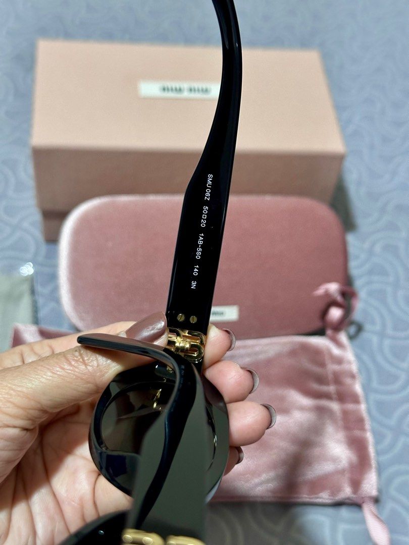 Miu Miu Oval Sunglasses