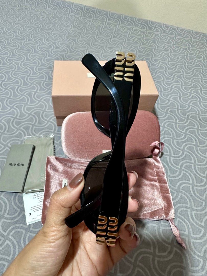 Miu Miu Oval Sunglasses