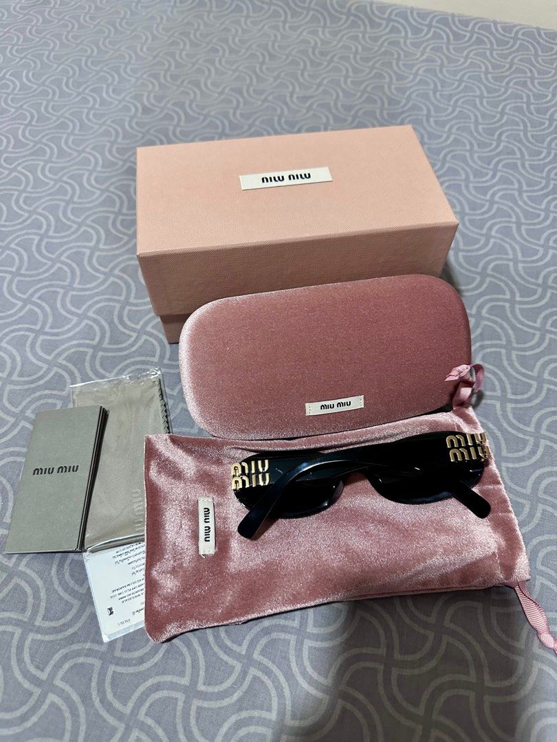 Miu Miu Oval Sunglasses